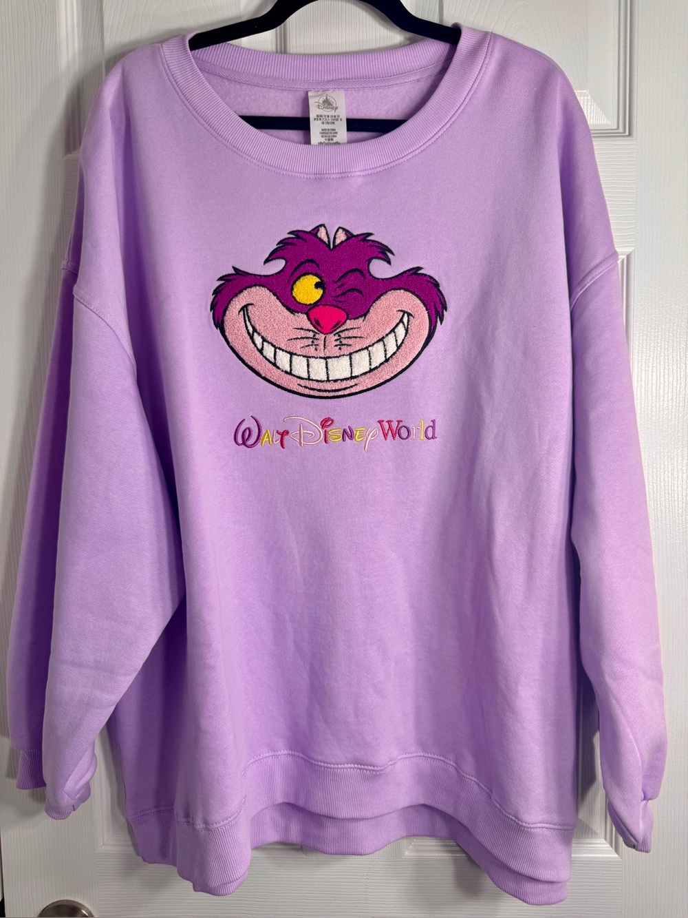 NWT Disney Parks Cheshire Cat Embroidered Lavender Sweatshirt 1X.